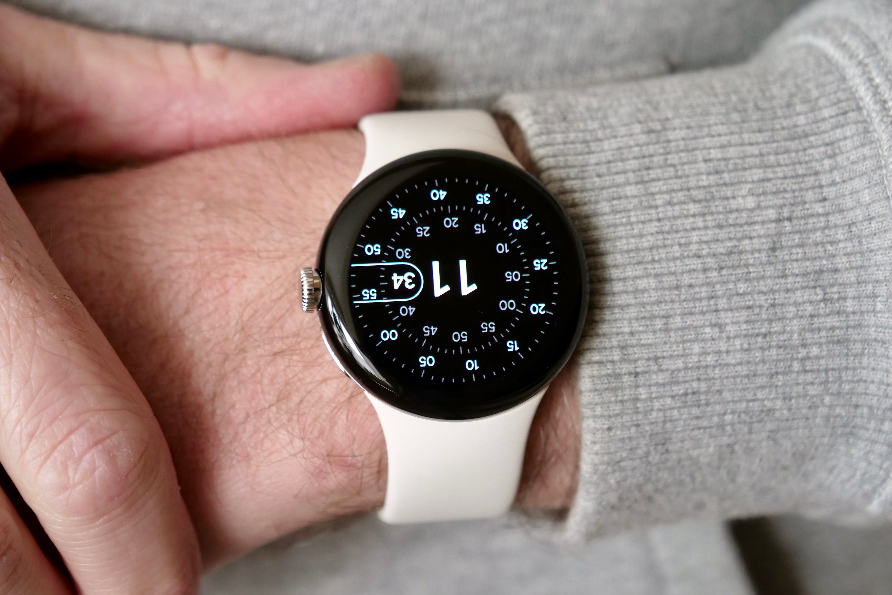 A person wearing the Google Pixel Watch.