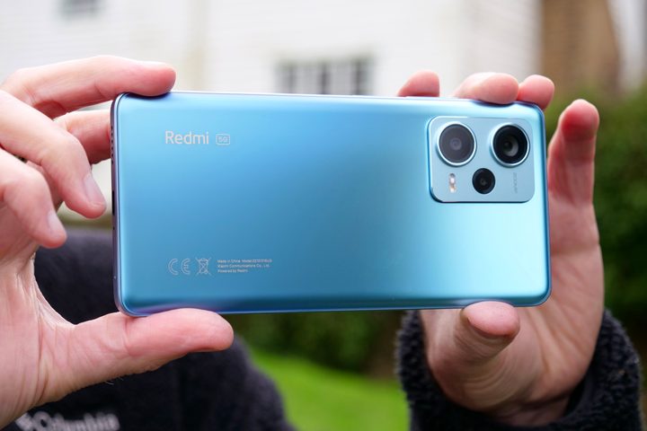 A person holding the Redmi Note 12 Pro+.