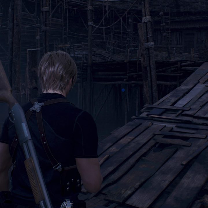 Leon looks at a blue medallion