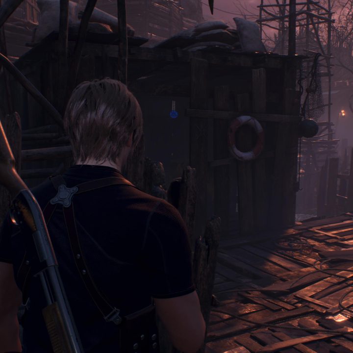 Leon looks at a blue medallion