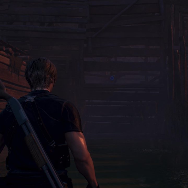 Leon looks at a blue medallion