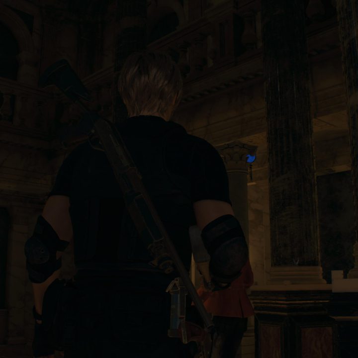 Leon looks at a blue medallion