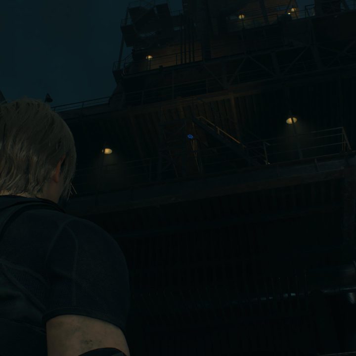 Leon looks at a blue medallion