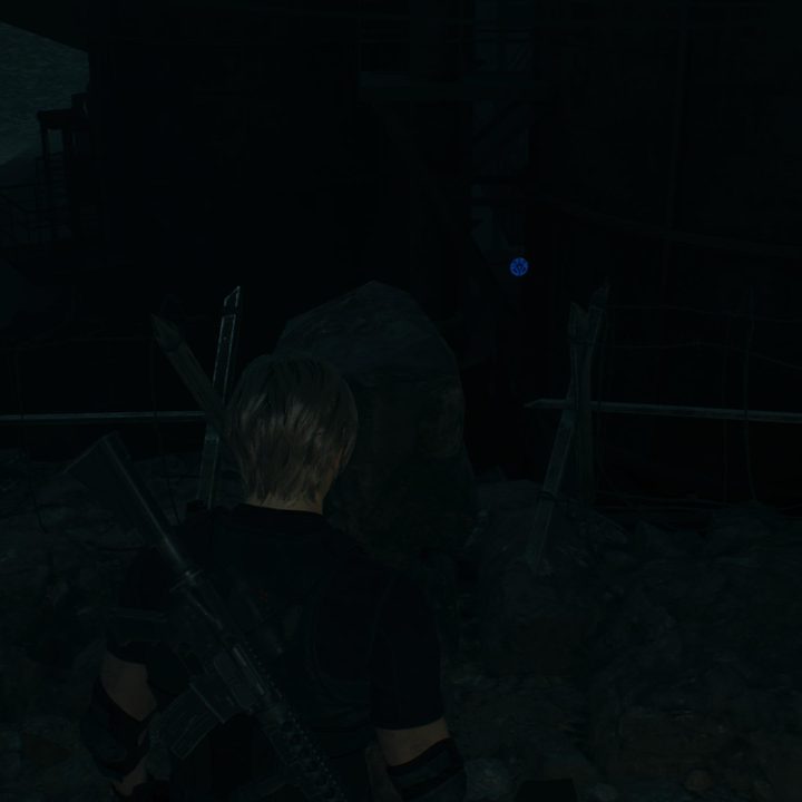 Leon looks at a blue medallion