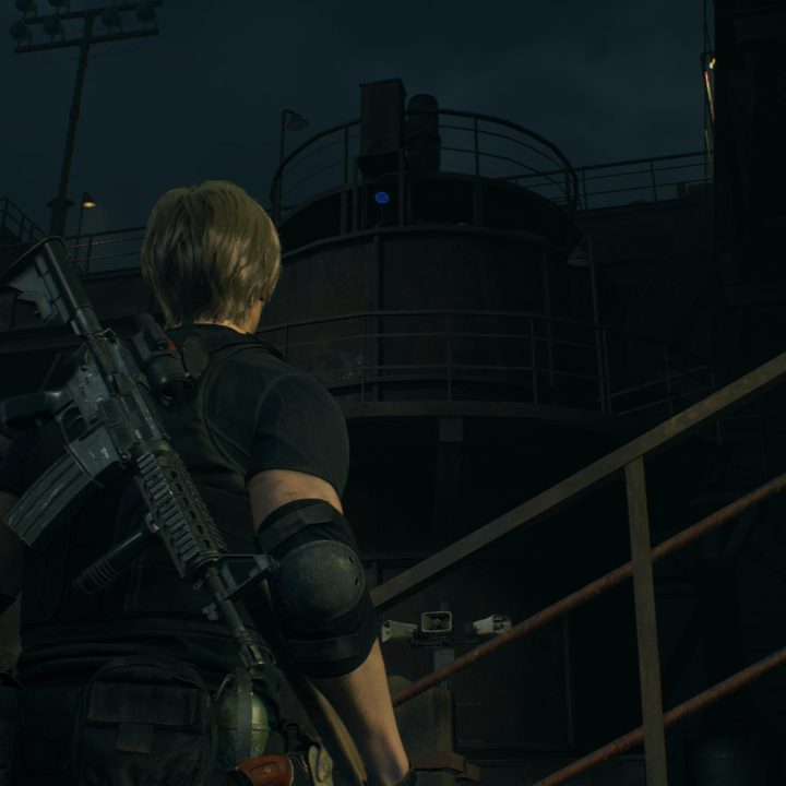 Leon looks at a blue medallion