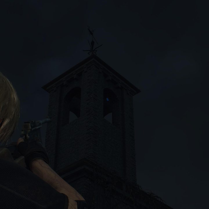 Leon looks at a blue medallion