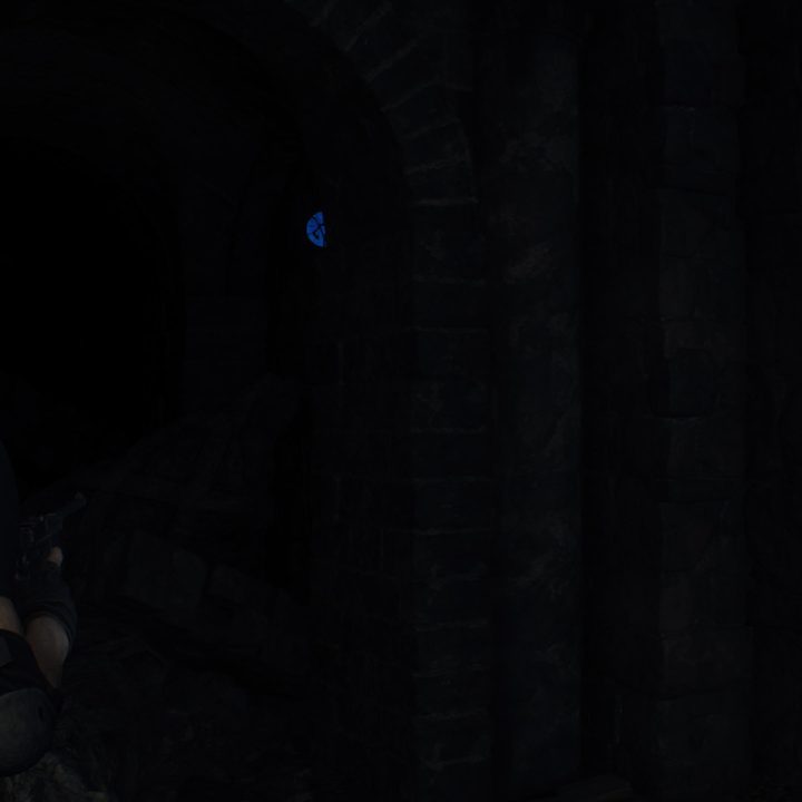 Leon looks at a blue medallion