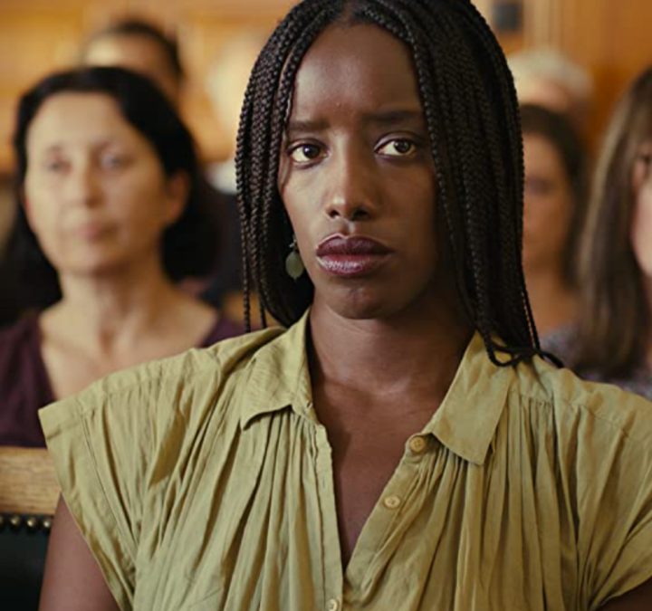 A woman sits in a courtroom in Saint Omer.