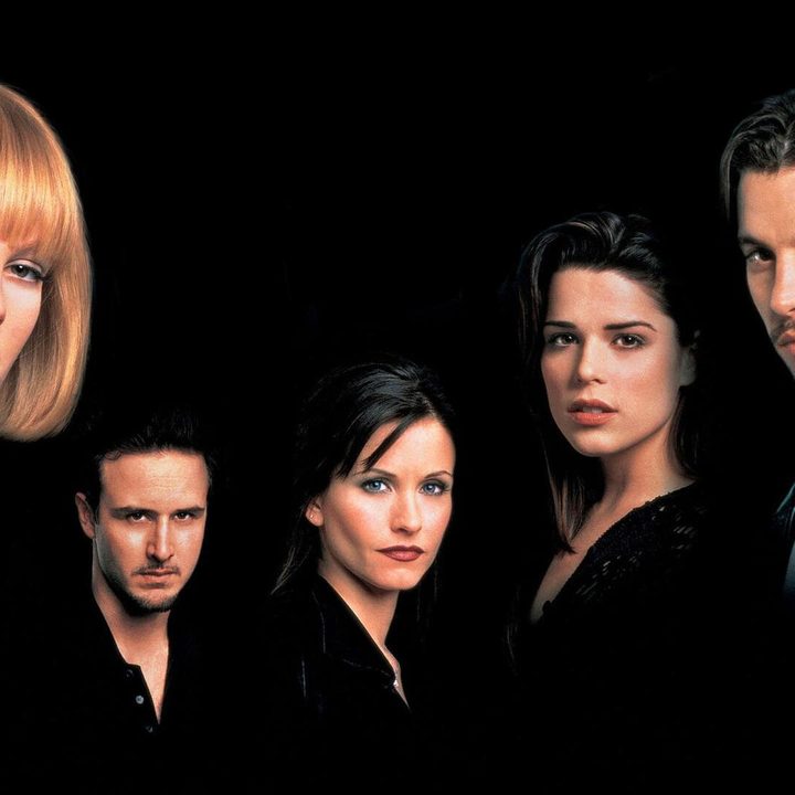Five people stare on a poster.