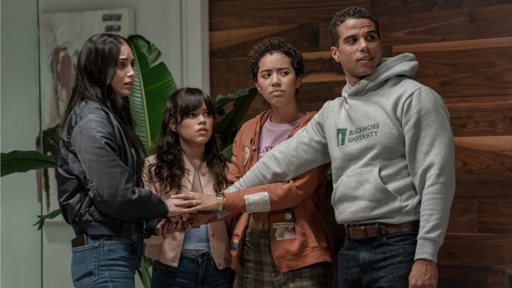 Four kids put their hands in from a scene from Scream VI.