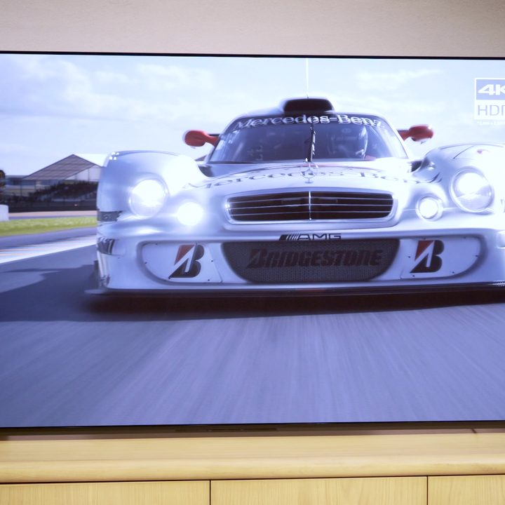 A sports car displayed on a Sony A95L.