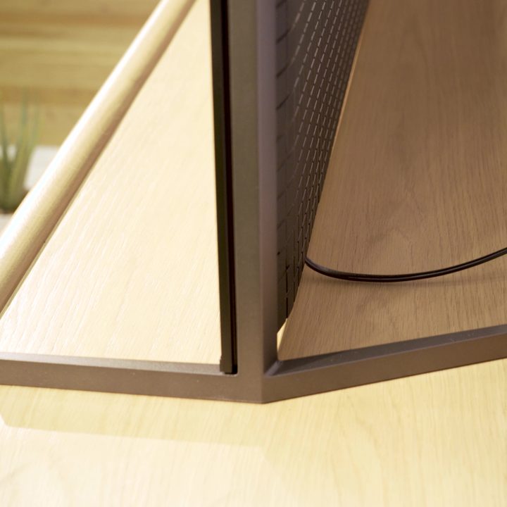 A closeup of the stand and profile of a Sony A95L.