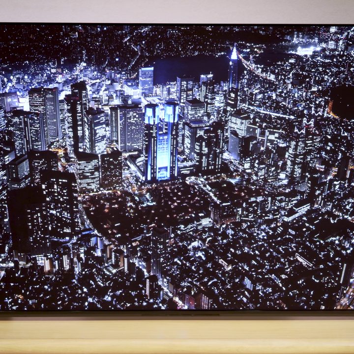 An aerial view of a skyline at night on a Sony A95L.