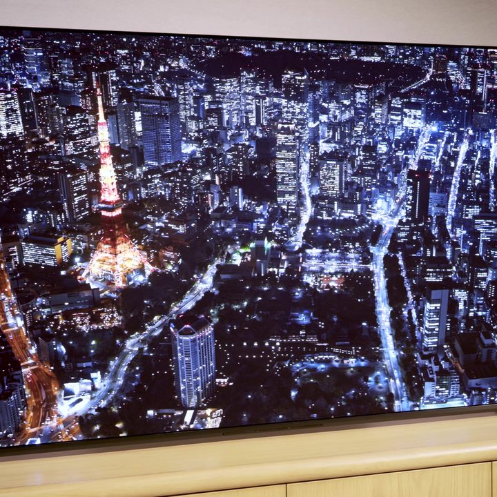 An aerial view of a skyline at night on a Sony A95L.