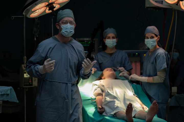 Joel holds the surgeons at gunpoint in The Last of Us' finale.