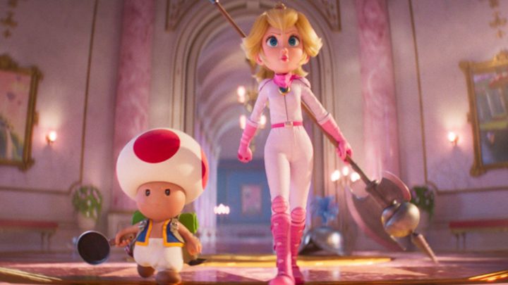 Toad and Peach walking inside a castle in in The Super Mario Bros. Movie.