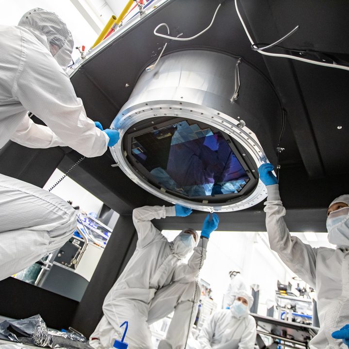 Members of the LSST camera team prepare for the installation of the L3 lens onto the focal plane of the camera.