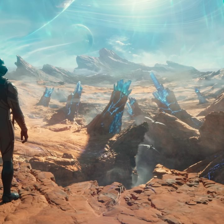 A person in a spacesuit looks out over and alien landscape in the trailer for The Outer Worlds 2.