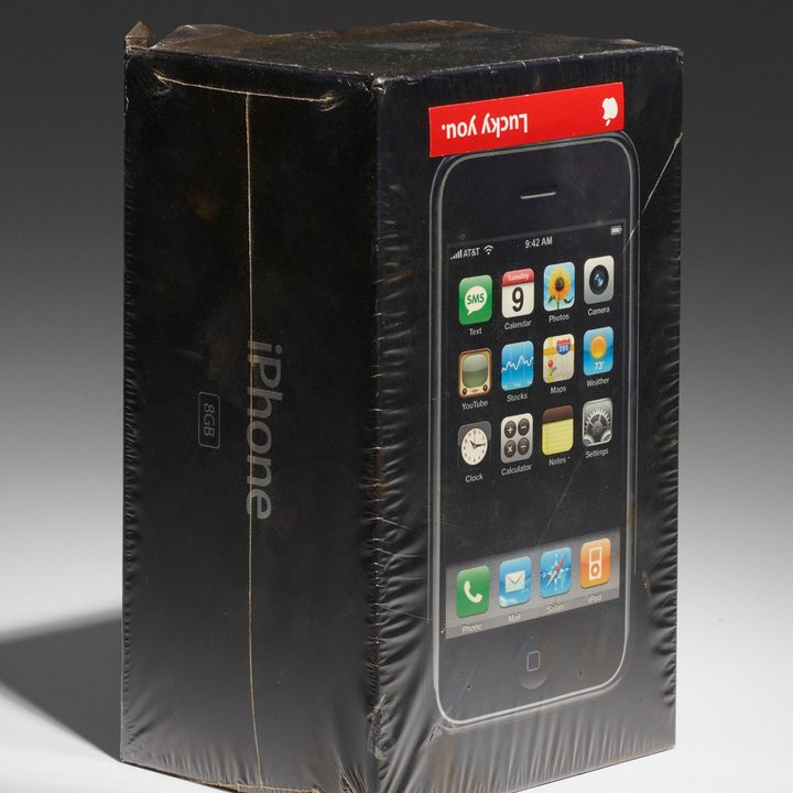 Sealed, 2007 iPhone with a red "Lucky You" sticker on it.