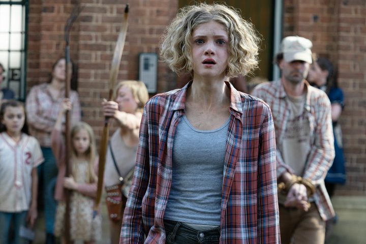 A girl looks shocked in Children of the Corn.
