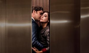 A man and a woman embrace in an elevator in Fatal Attraction.