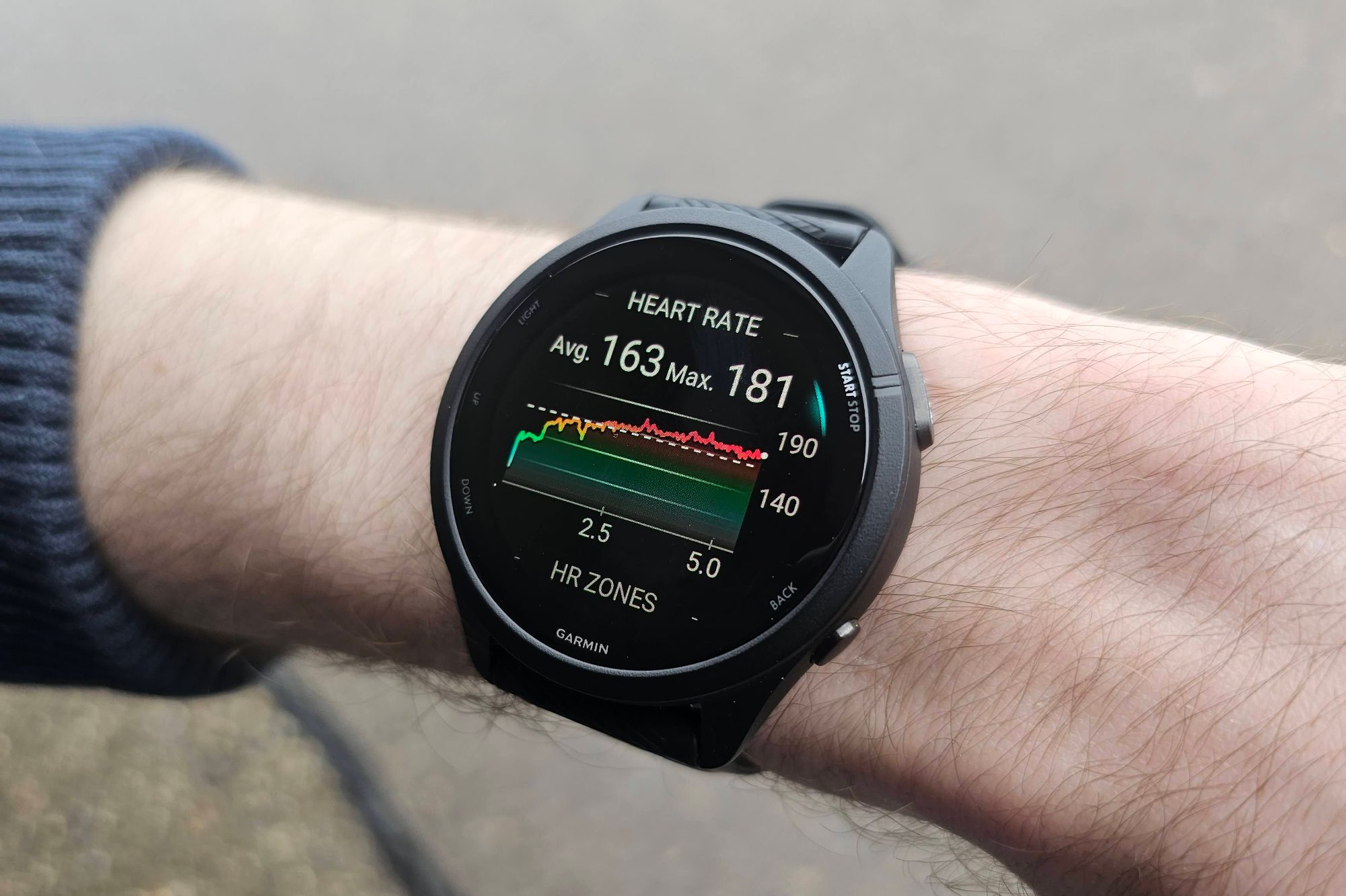 Someone wearing the Garmin Forerunner 265 on their wrist.
