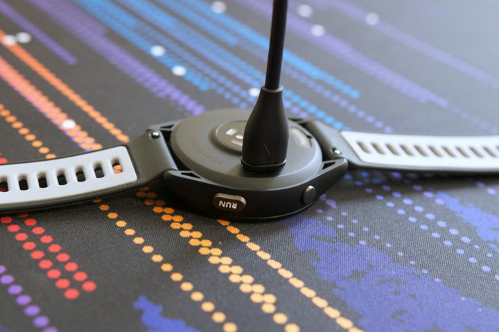 Charging cable plugged into the Garmin Forerunner 265.