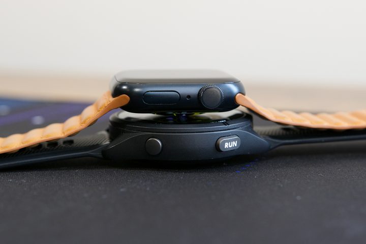 Apple Watch Series 7 next to the Garmin Forerunner 265.