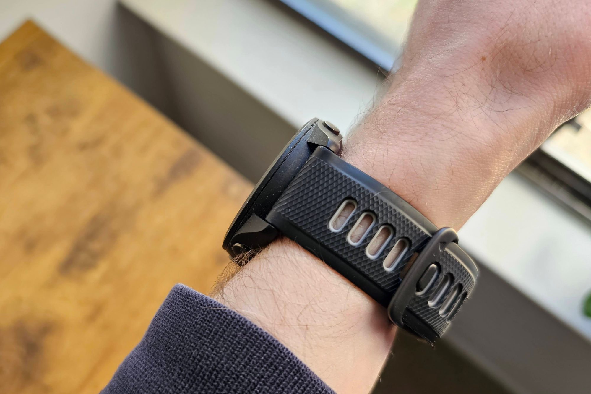 Someone wearing the Garmin Forerunner 265 on their wrist.