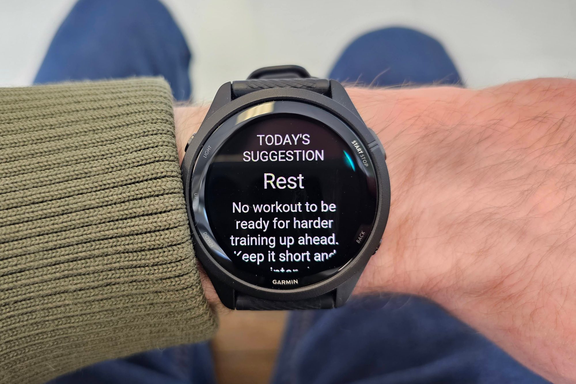 Someone wearing the Garmin Forerunner 265 on their wrist.