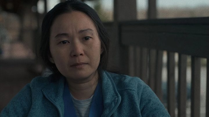 Hong Chau sits and stares in a scene from The Whale.