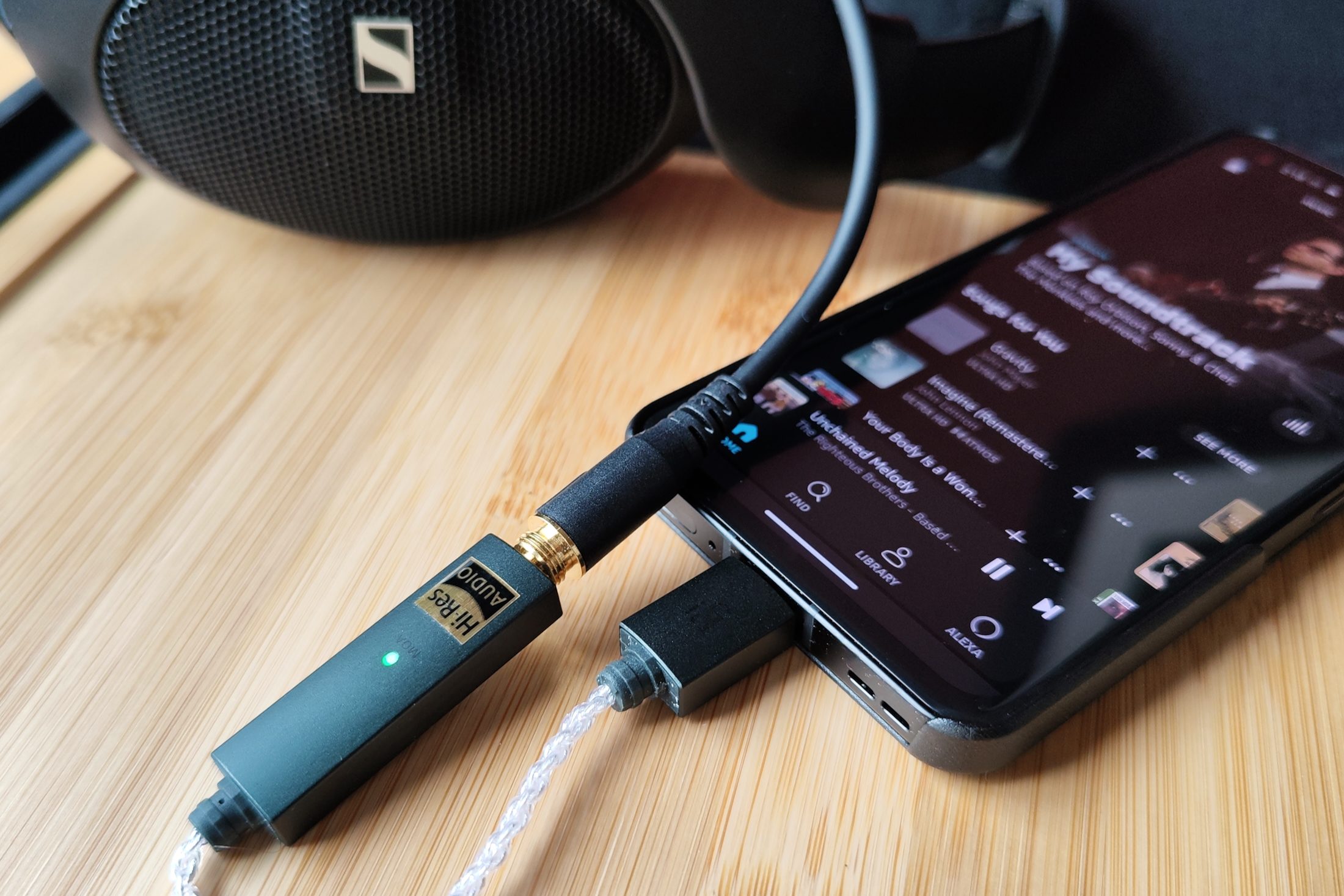 Ifi Go Link headphone amp/DAC plugged into an Asus Zenfone 9 and Sennheiser HD 560S.
