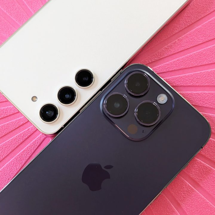 Deep purple iPhone 14 Pro and Cream Galaxy S23 cameras closeup