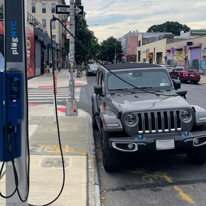 Jeep Wrangler 4xe charging at a NYC curbside charger.