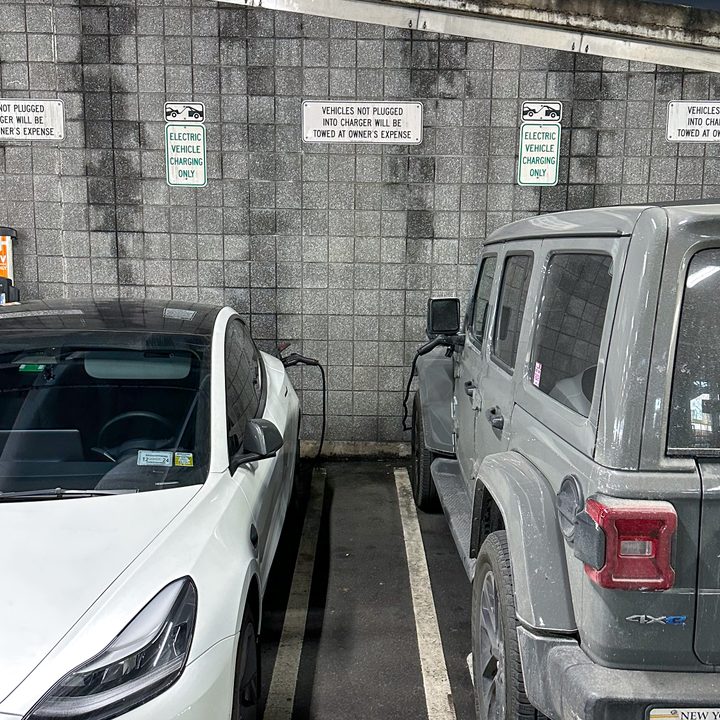 Jeep Wrangler 4xe and Tesla Model 3 charging.