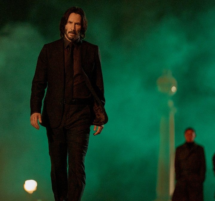 Keanu Reeves walks toward the camera in John Wick: Chapter 4.