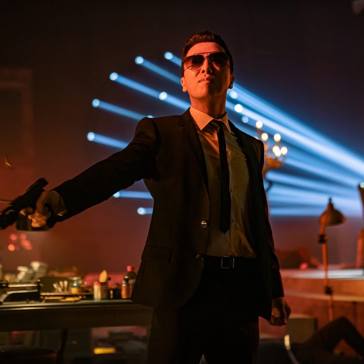 A man stands and points a gun in John Wick: Chapter 4.