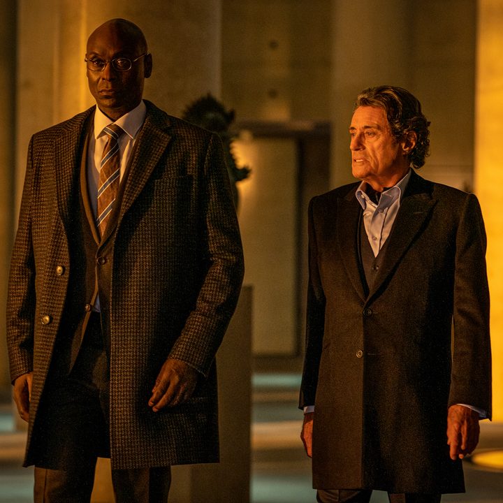 Two men stand next to each other and walk in John Wick Chapter 4.