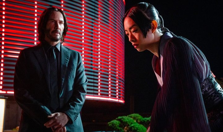 John looks at Akira in John Wick: Chapter 4.