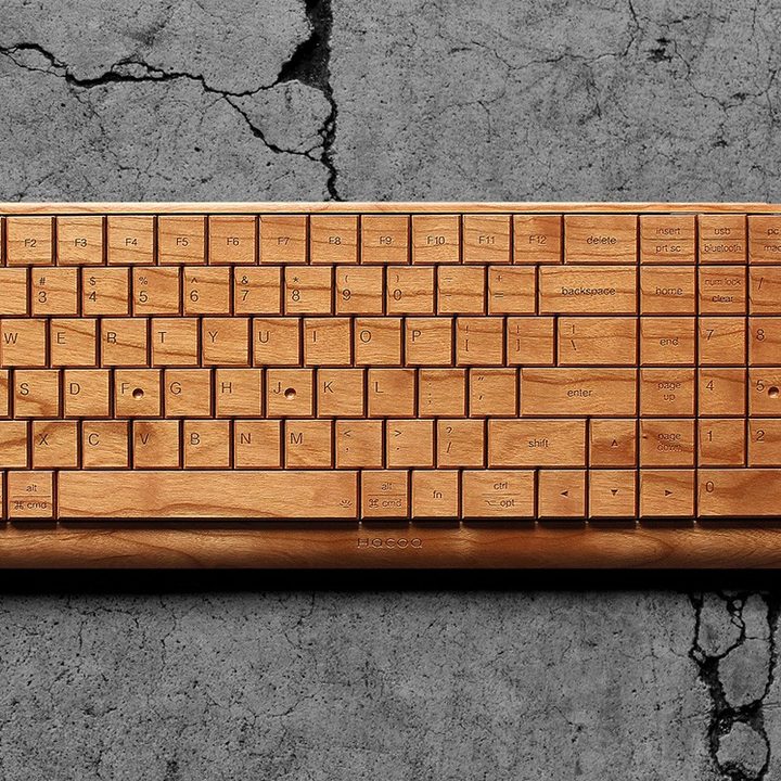 A wooden keyboard on a granite countertop.
