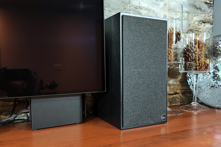 Klipsch The Sevens beside a TV.