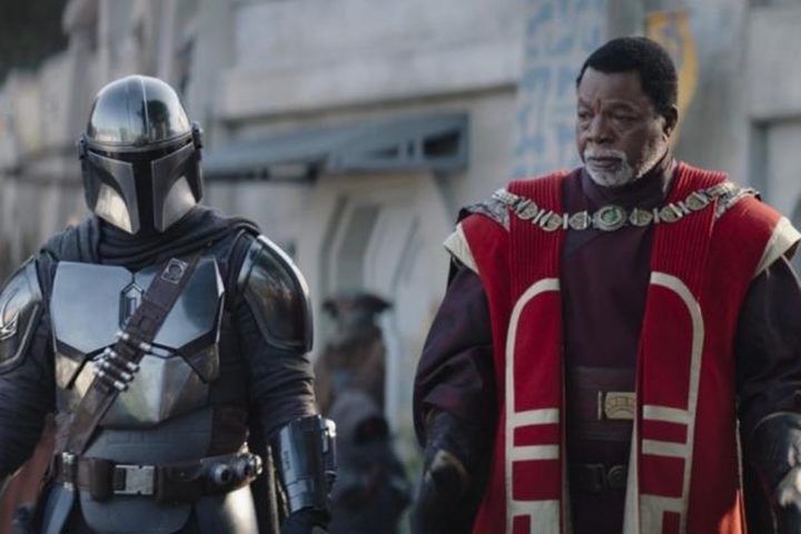 Din stands next to Greef in The Mandalorian.