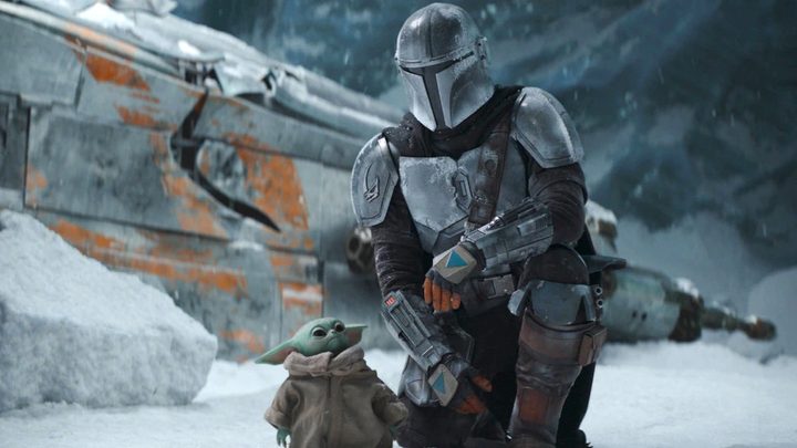 Din and Grogu sit in snow in The Mandalorian.