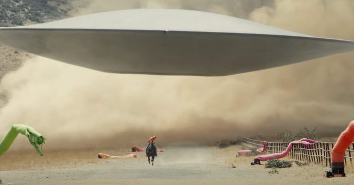 A man runs from a UFO in Nope.