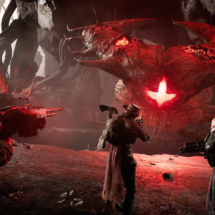 Three characters shoot at a boss in Remnant 2.