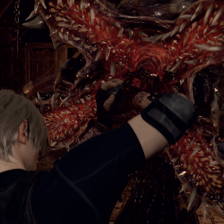 Leon fights off a parasite in Resident Evil 4's remake.