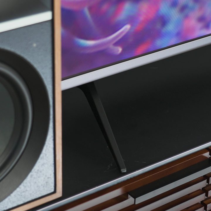 Closeup of front bottom bezel on a Roku Plus Series TV.