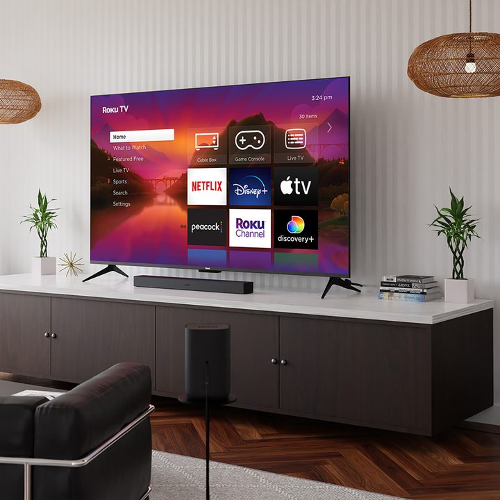 Roku Plus Series television in a living room setting.