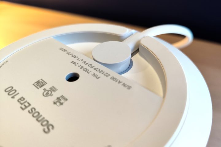 Sonos Era 100 bottom panel showing threaded mounting hole and power cord connection.