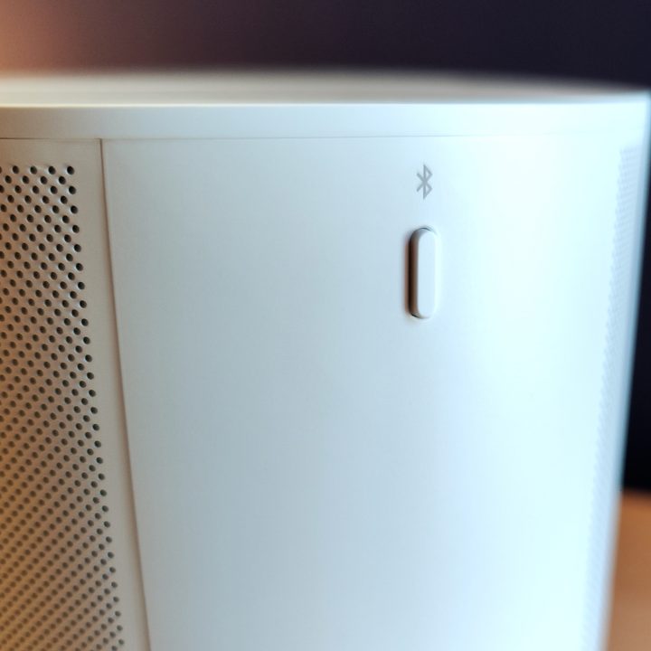 Close-up of the Bluetooth button on a Sonos Era 100 speaker.